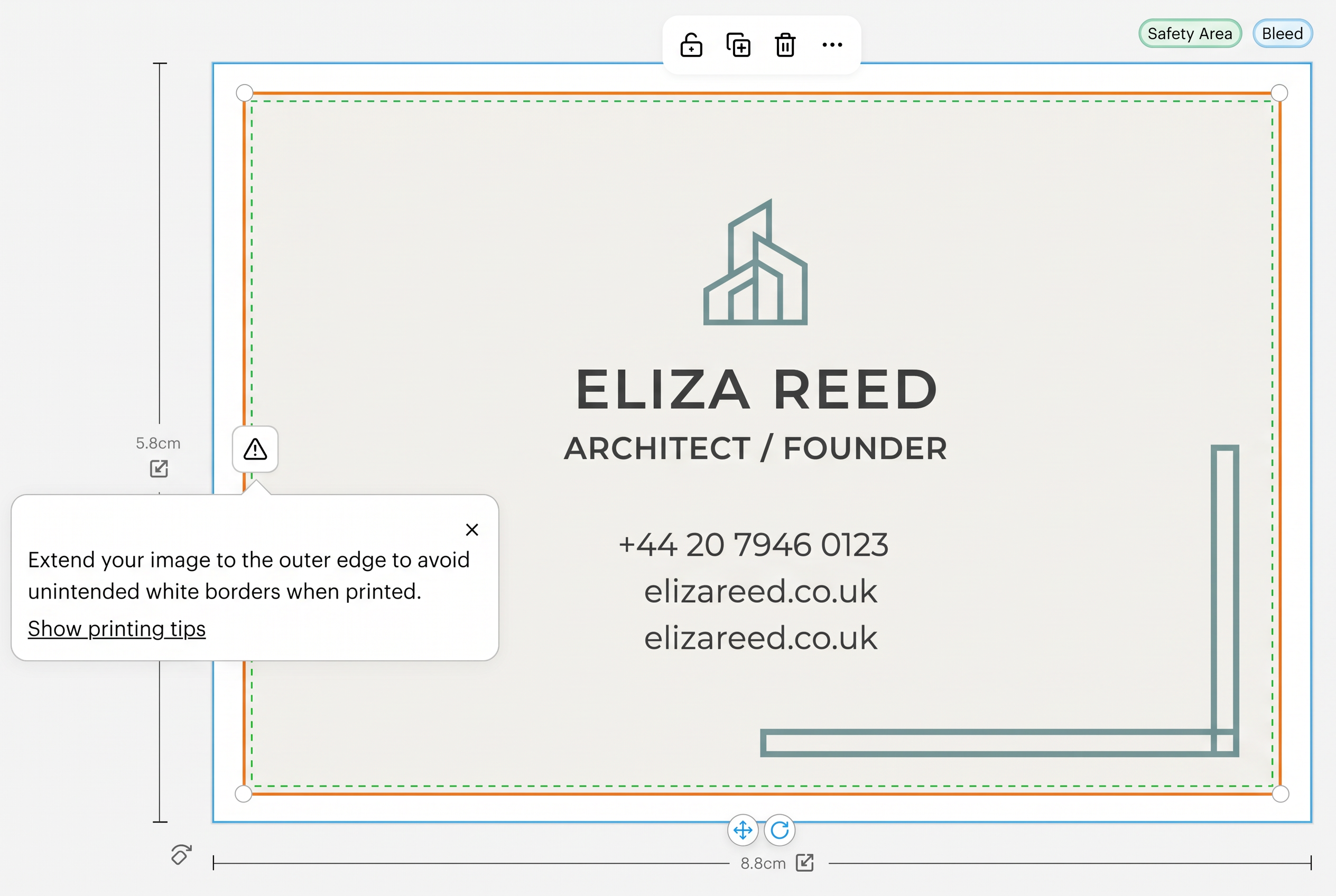 VistaPrint editor showing a realistic business card with the warning 'Extend your image to the outer edge to avoid unintended white borders when printed'